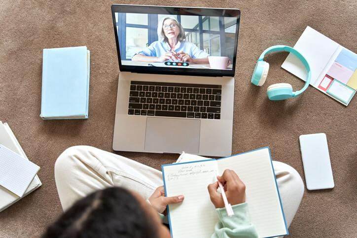 A student studying English online from home