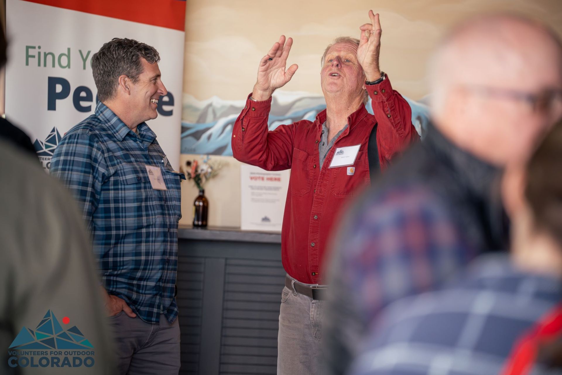 Two volunteers chat animatedly