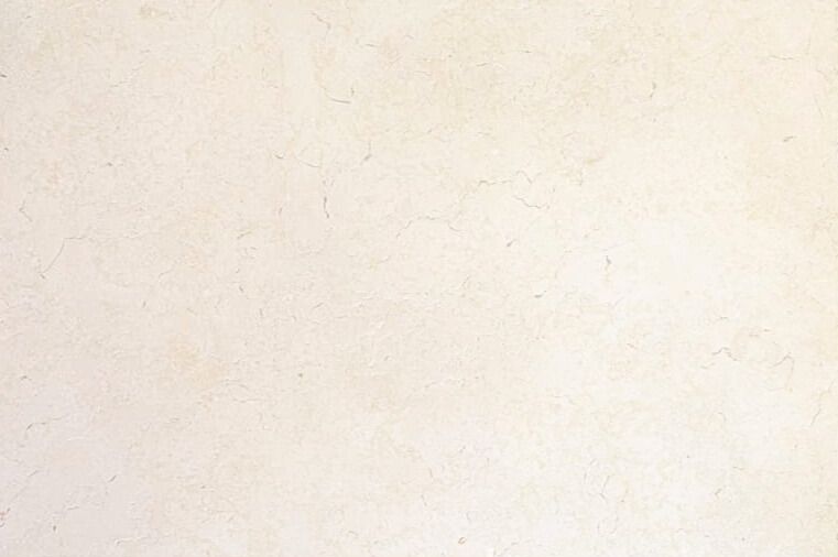 Beige sand, with curved lines and subtle texture, suggesting wind or water erosion.