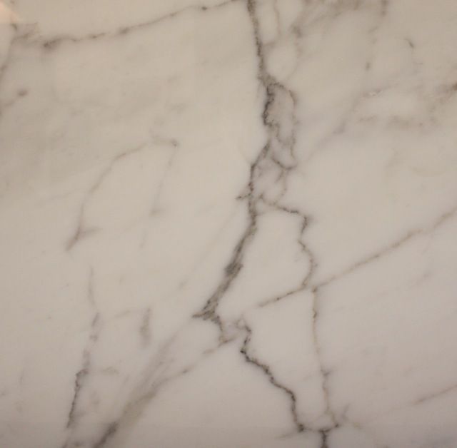 White marble countertop with gray veining.