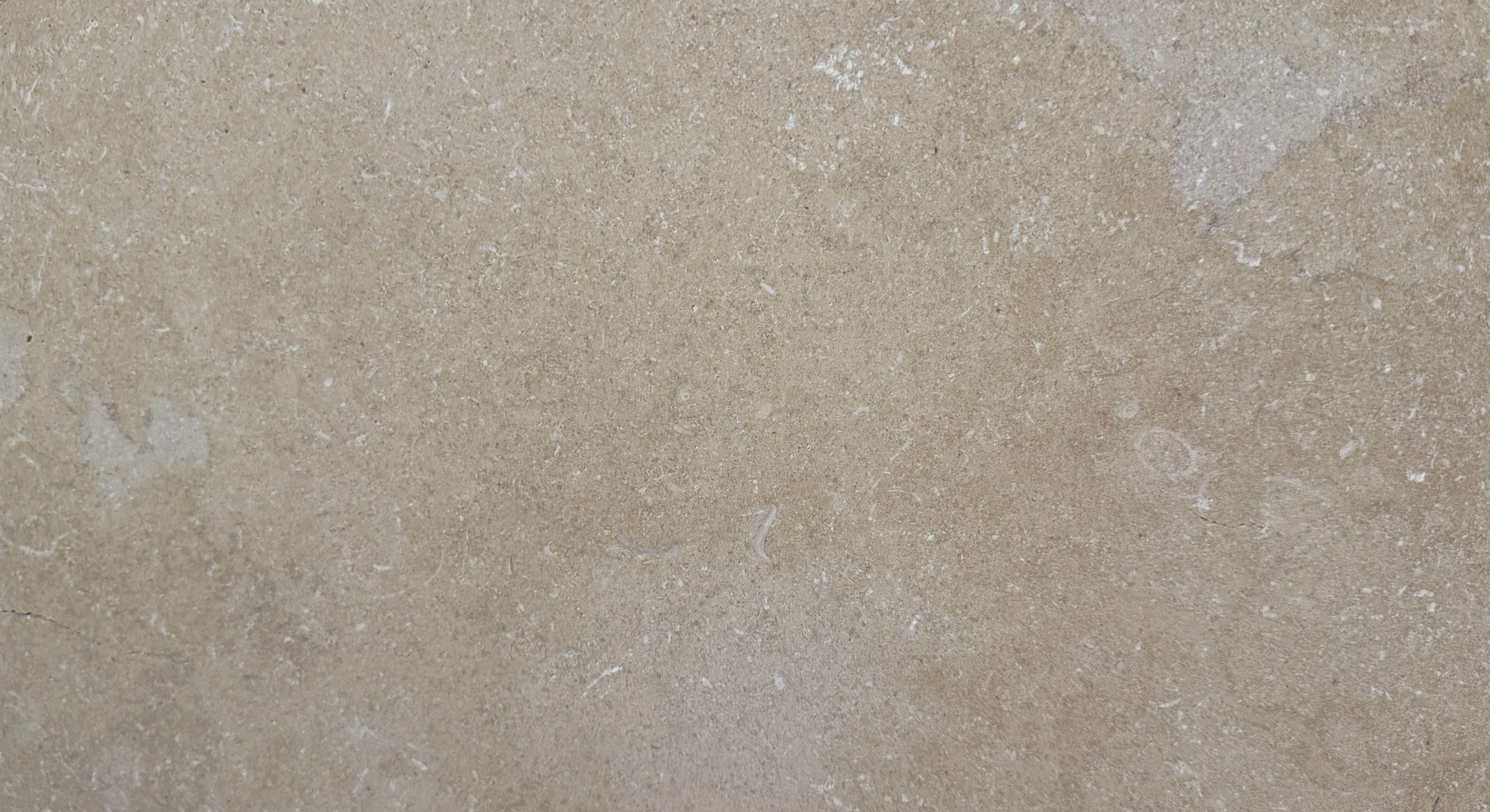 Gray stone texture with subtle variations and a diagonal line.