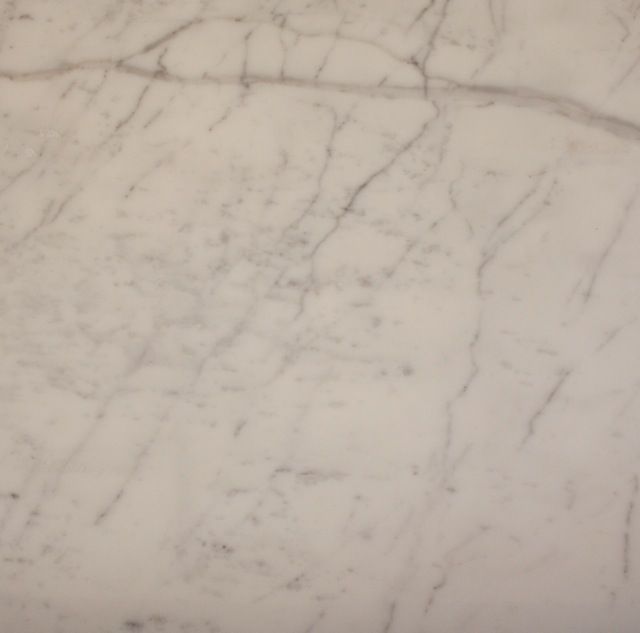White marble countertop with gray veining.