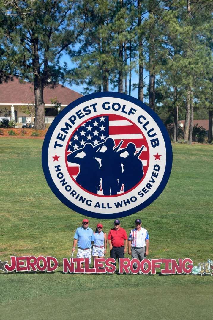 Sign for Tempest Golf Club with golfers and a logo honoring veterans.
