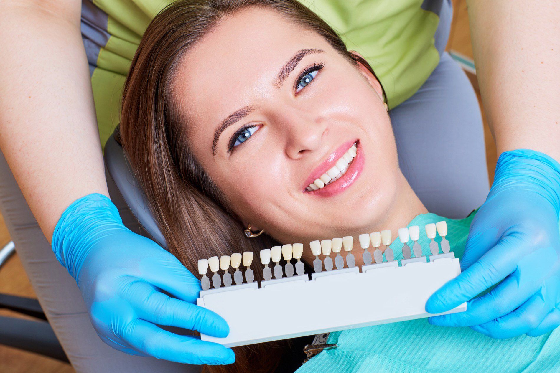Woman selecting dental implants at dentist's office