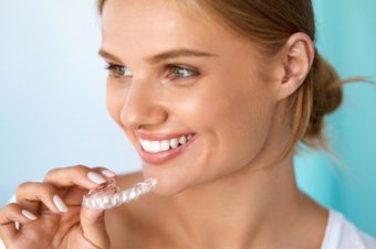 Woman at cosmetic dentist's office with an Invisalign