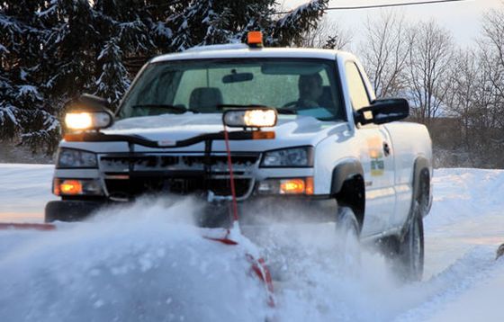 Truck plowing snow in Wasilla, AK