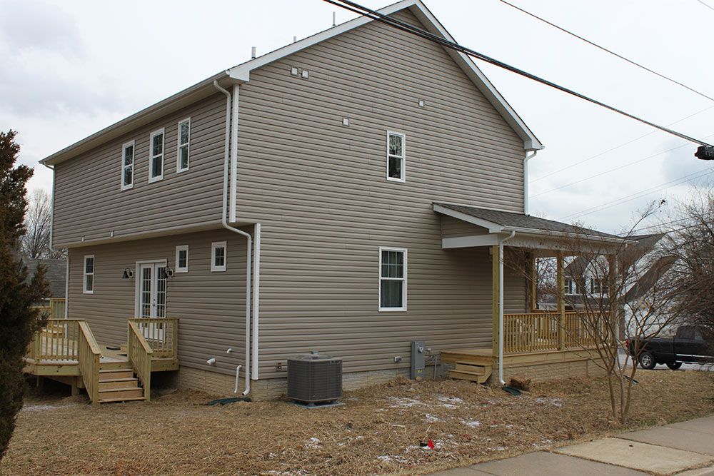 The back of a house with a deck and stairs