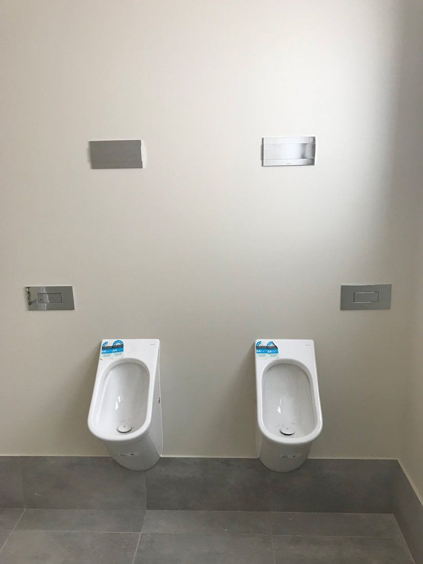 Two Urinal Toilet Bowl — Plumber In Dubbo, NSW