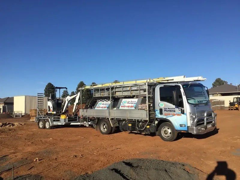Plumber Fixing Kitchen Sink — Plumber In Dubbo, NSW