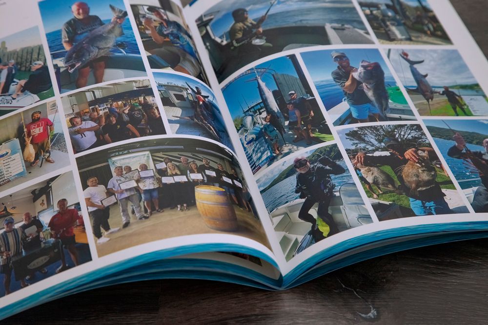 Open book with numerous photos of people fishing, some with large fish.