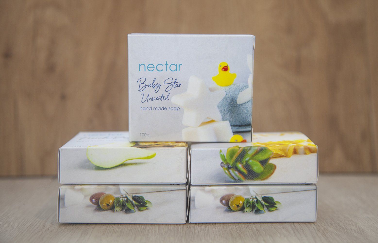 Stack of white boxes of chocolate, one with a duck graphic. From Excel In Print Auckland. 