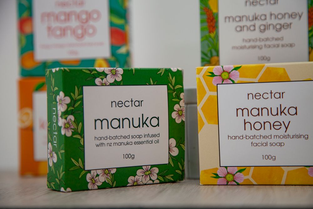Close-up of four soaps with different labels: 