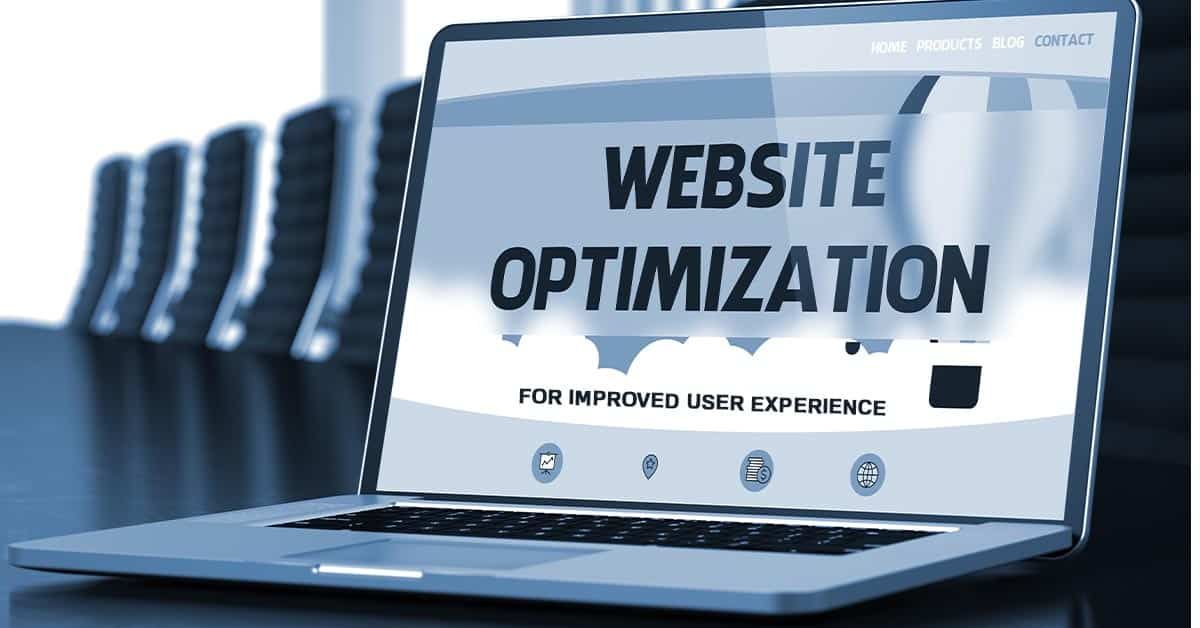 A laptop computer is open to a page that says website optimization.