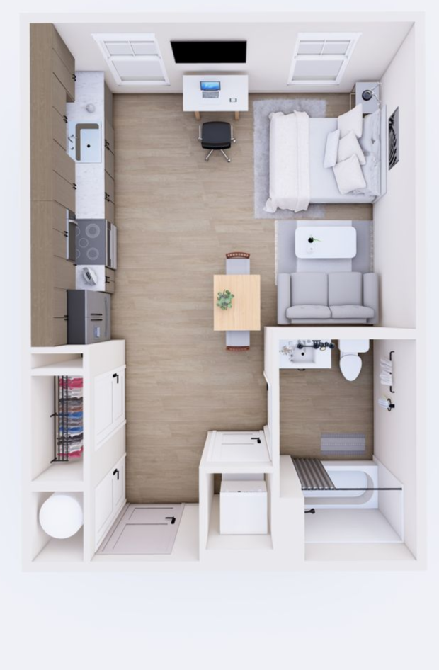 Overhead view of a small apartment layout. Kitchen, living, and sleeping areas are visible, with light wood flooring.