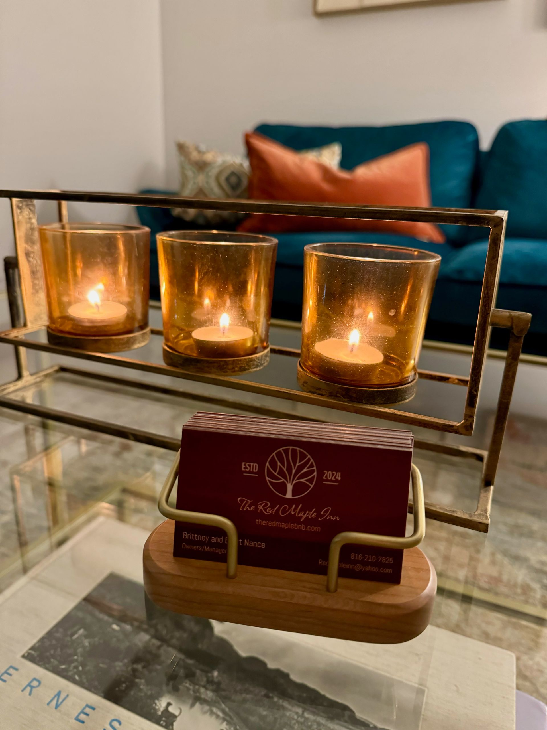 A couple standing in front of a large brown house