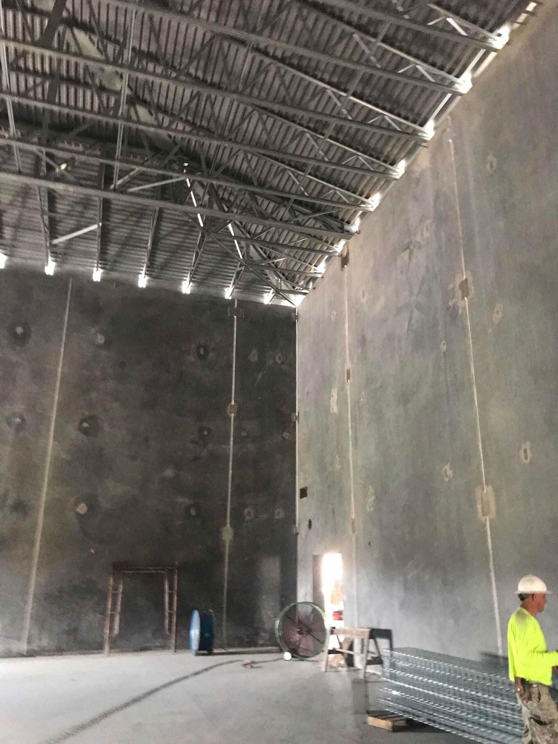 concrete walls being caulked
