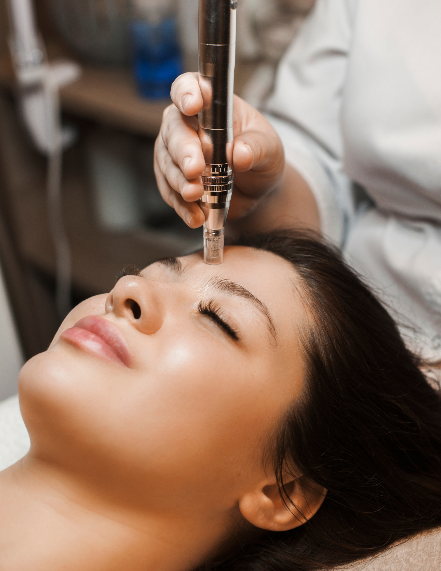 A woman is getting a massage on her back at a spa.