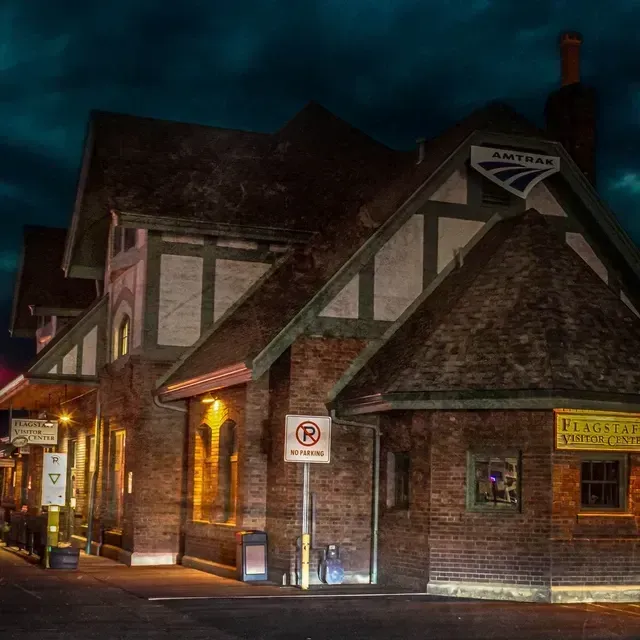 A brick building with a no parking sign in front of it