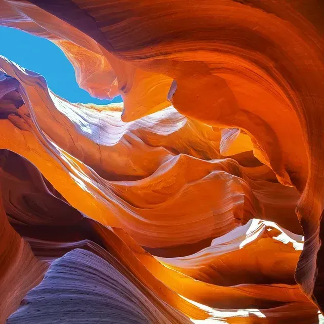 Looking up into a canyon with a blue sky in the background