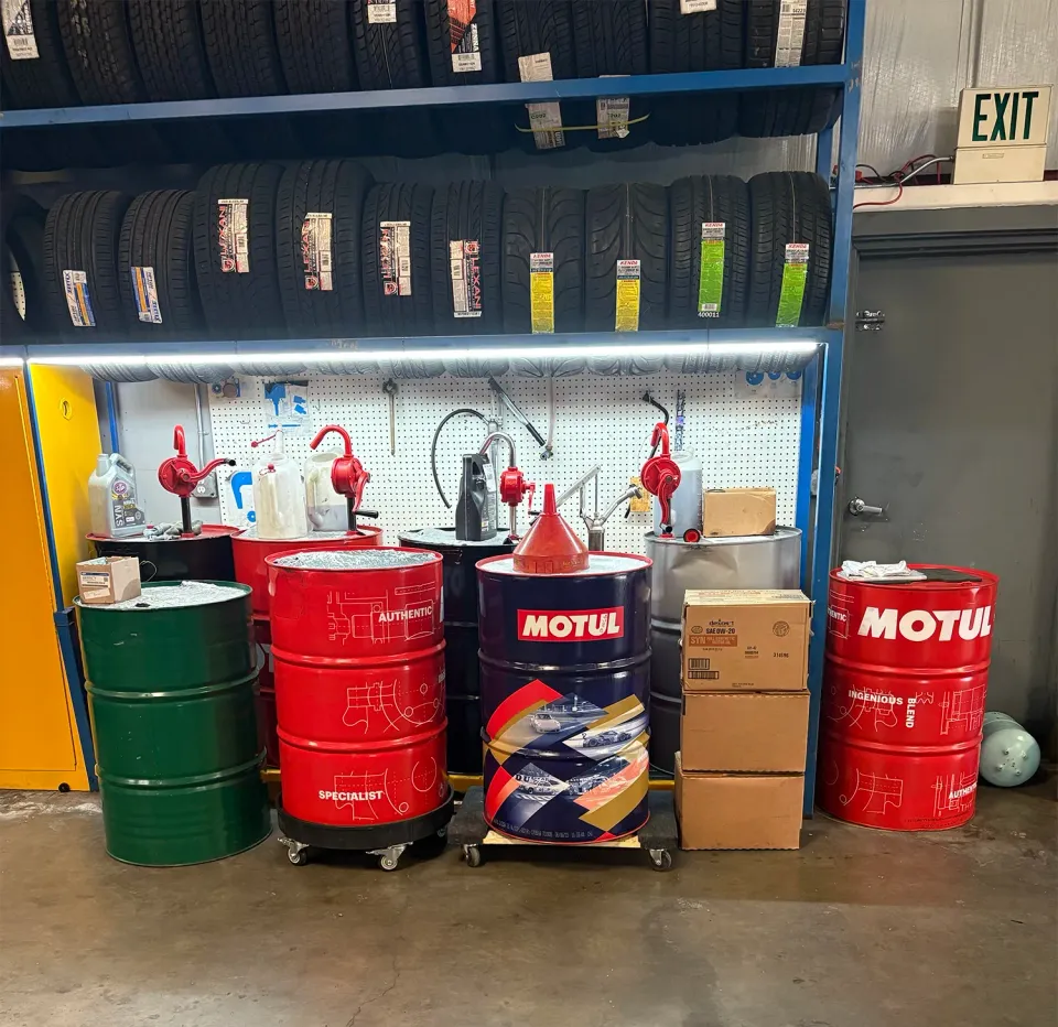 Barrels and racks of tires in our garage | Platinum Motors Martinez