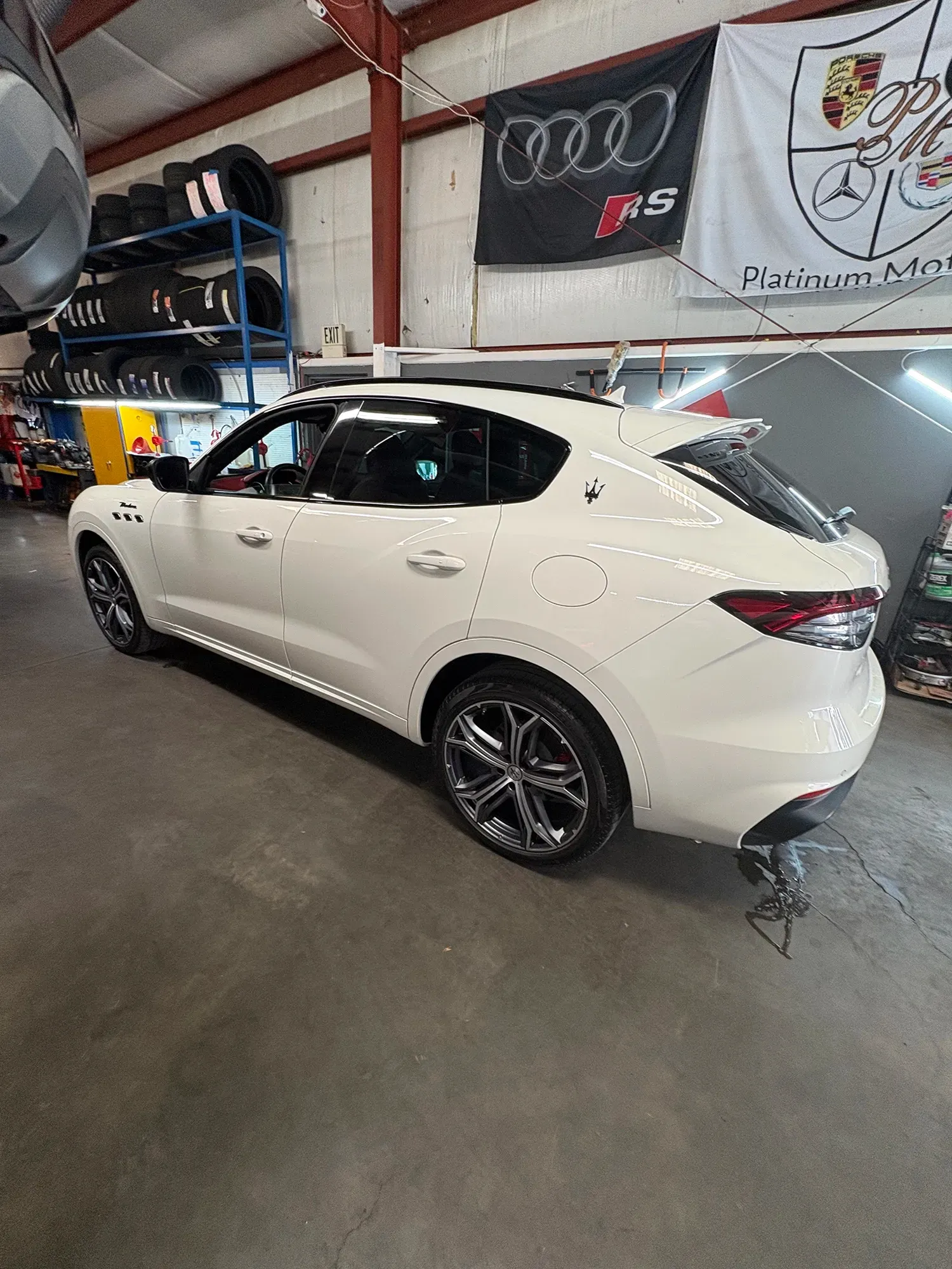 White van parked in our garage | Platinum Motors Martinez