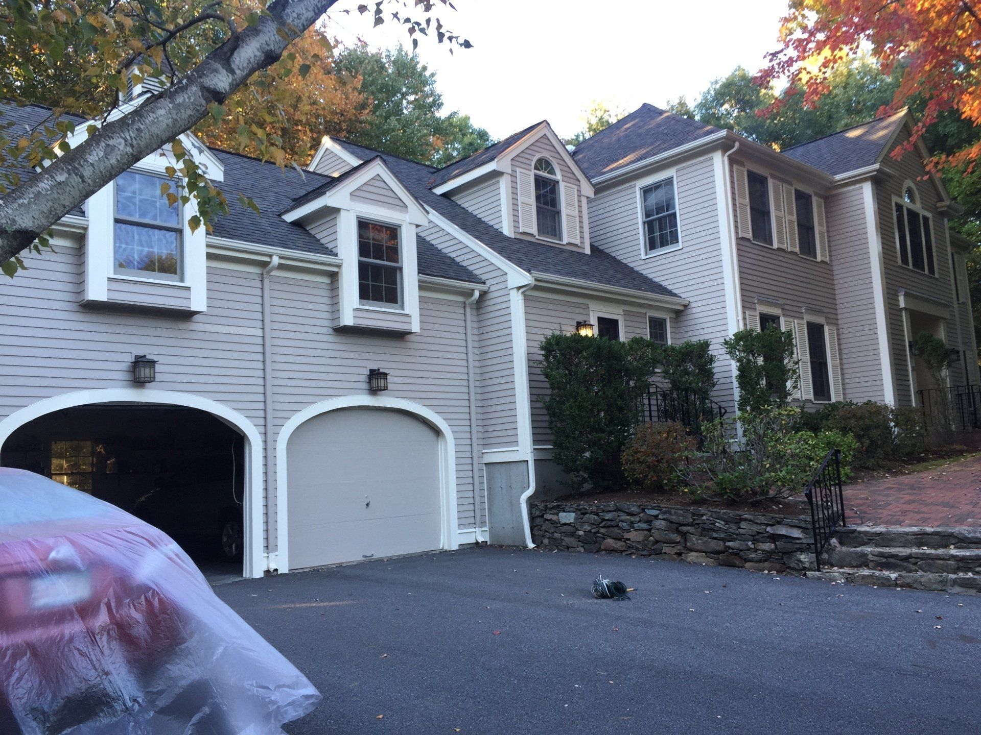 Cleaning service washing building facade with pressure water. Cleaning dirty wall with high pressure water jet.