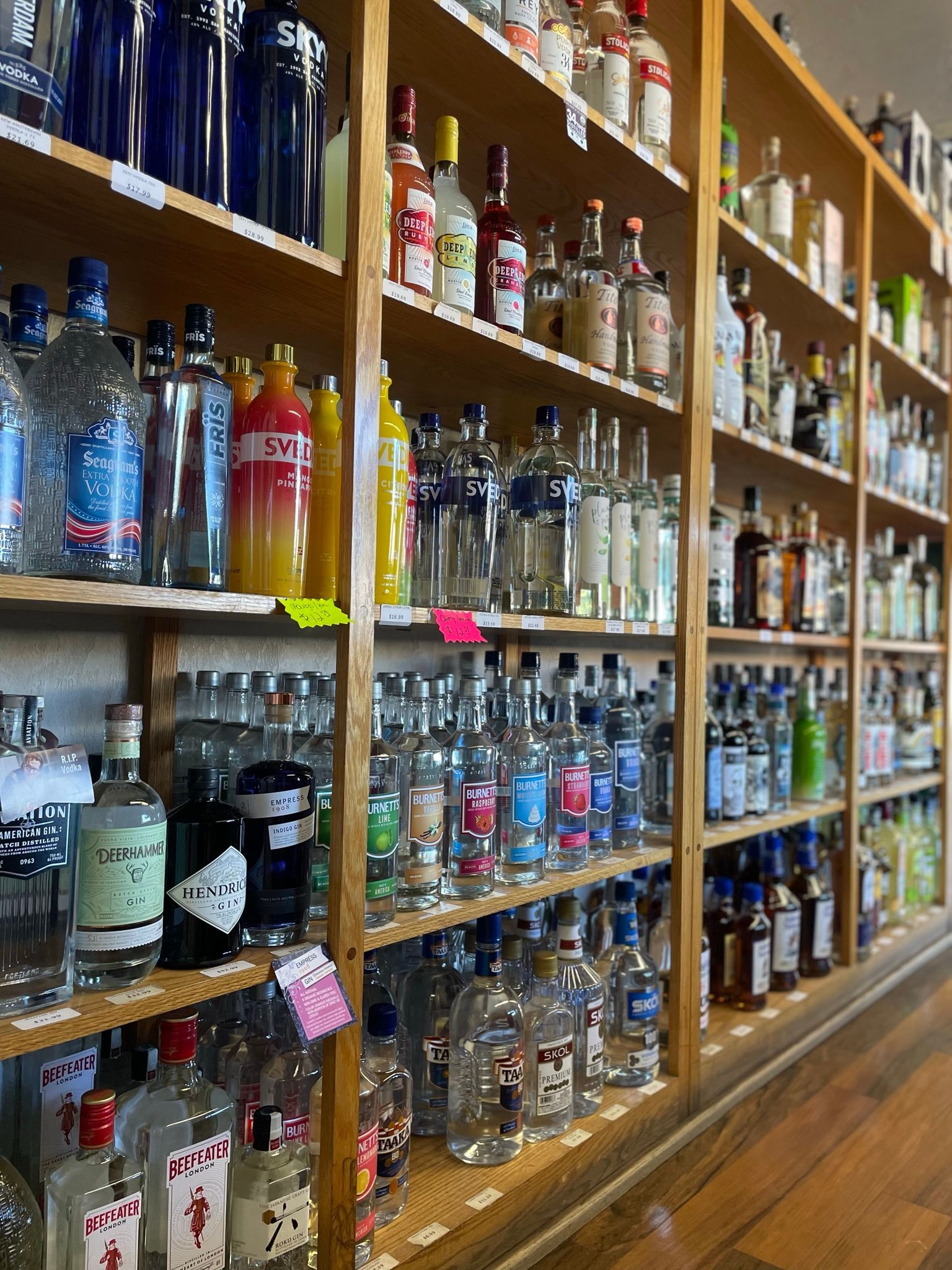 A liquor store filled with lots of bottles of liquor on shelves.