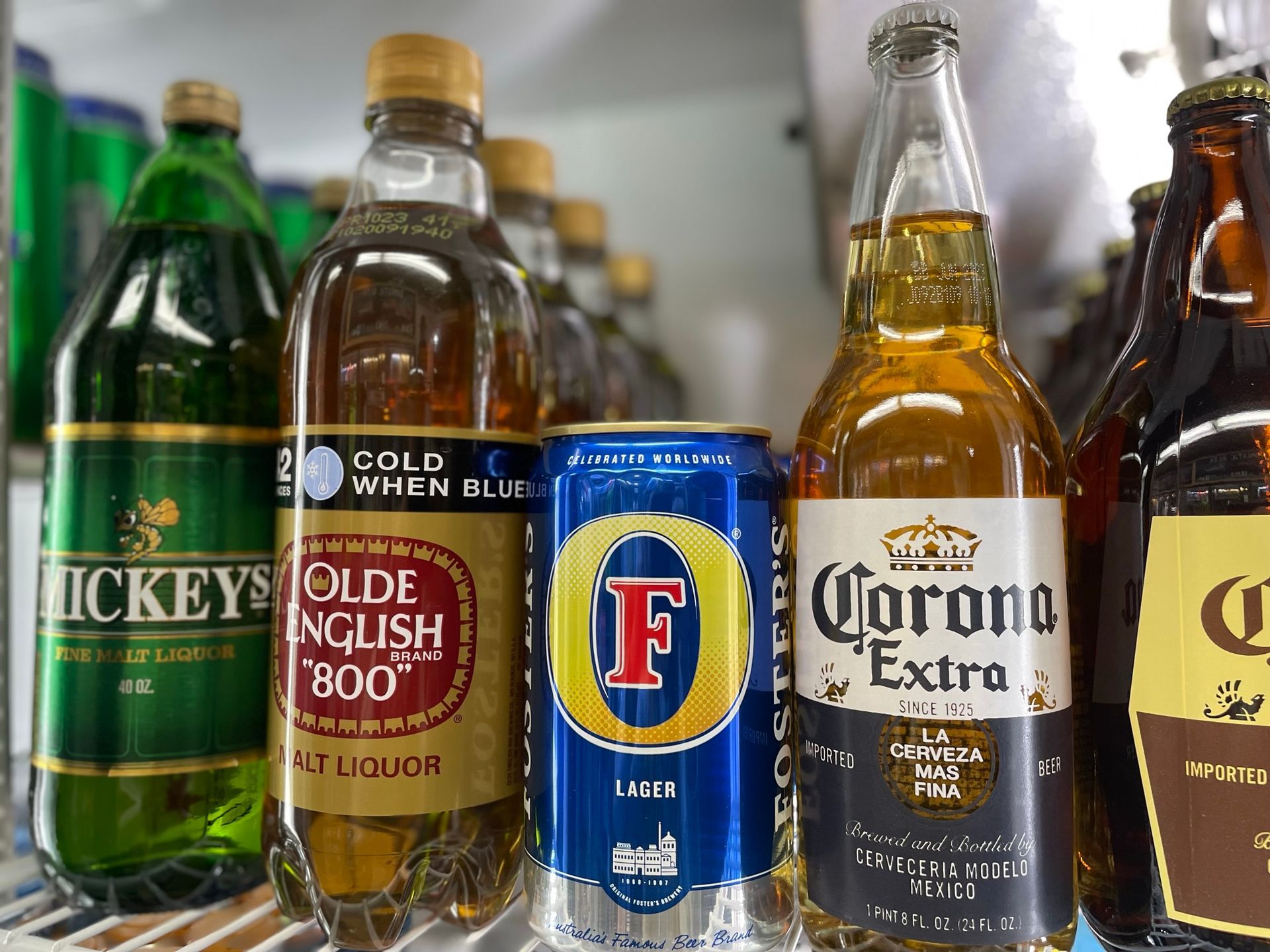 Several bottles and cans of alcohol including corona extra