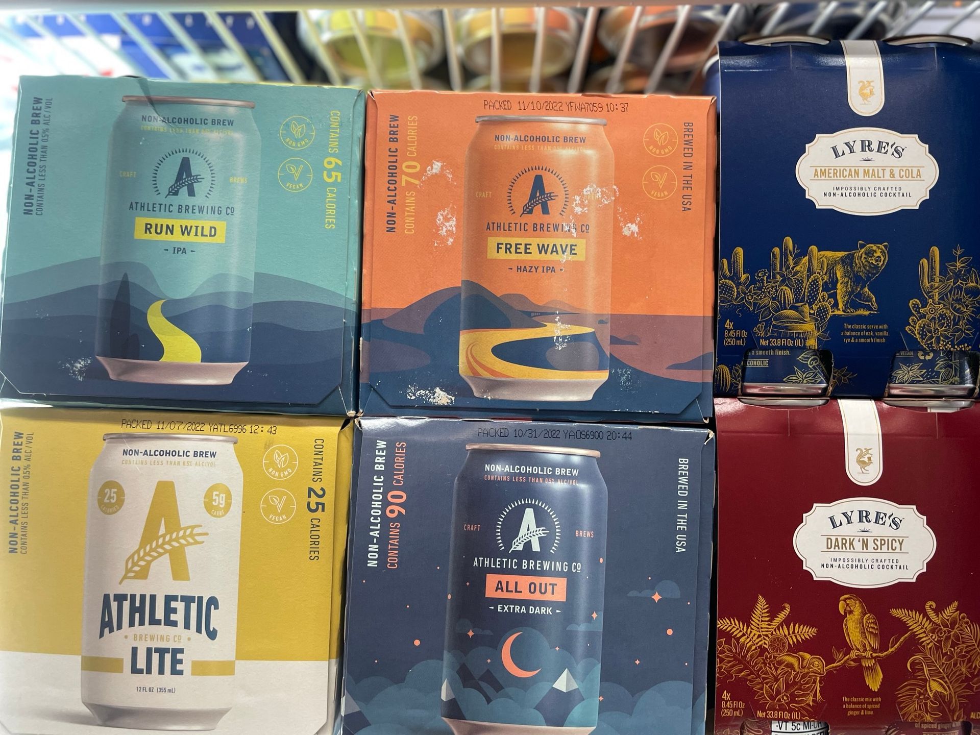 Six packs of athletic lite beer are stacked on top of each other