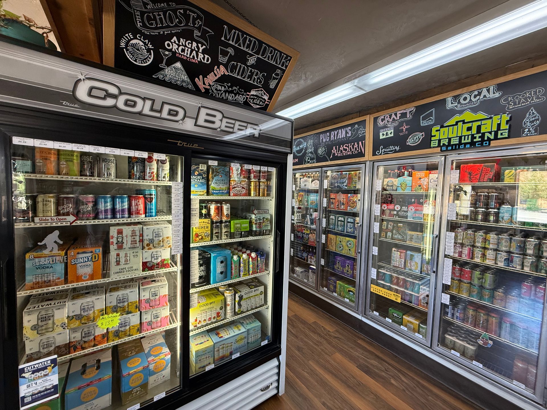 A refrigerator filled with lots of bottles of wine.
