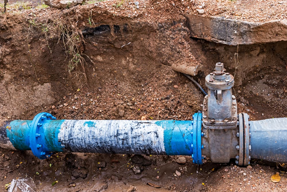Water PVC Plastic Pipes Underground — Plumbers In Gladstone, QLD