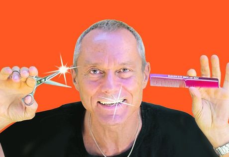 man holding scissors and comb