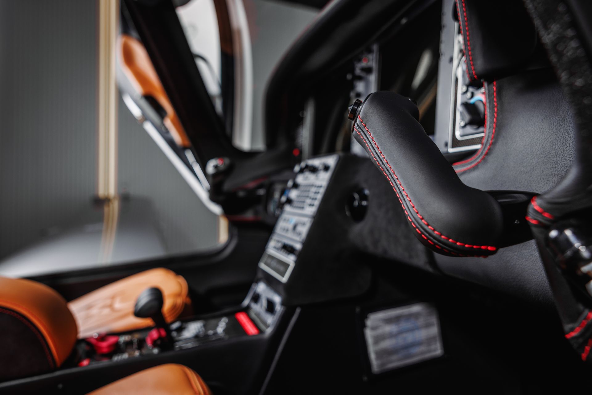 A close up of a car seat in a garage.