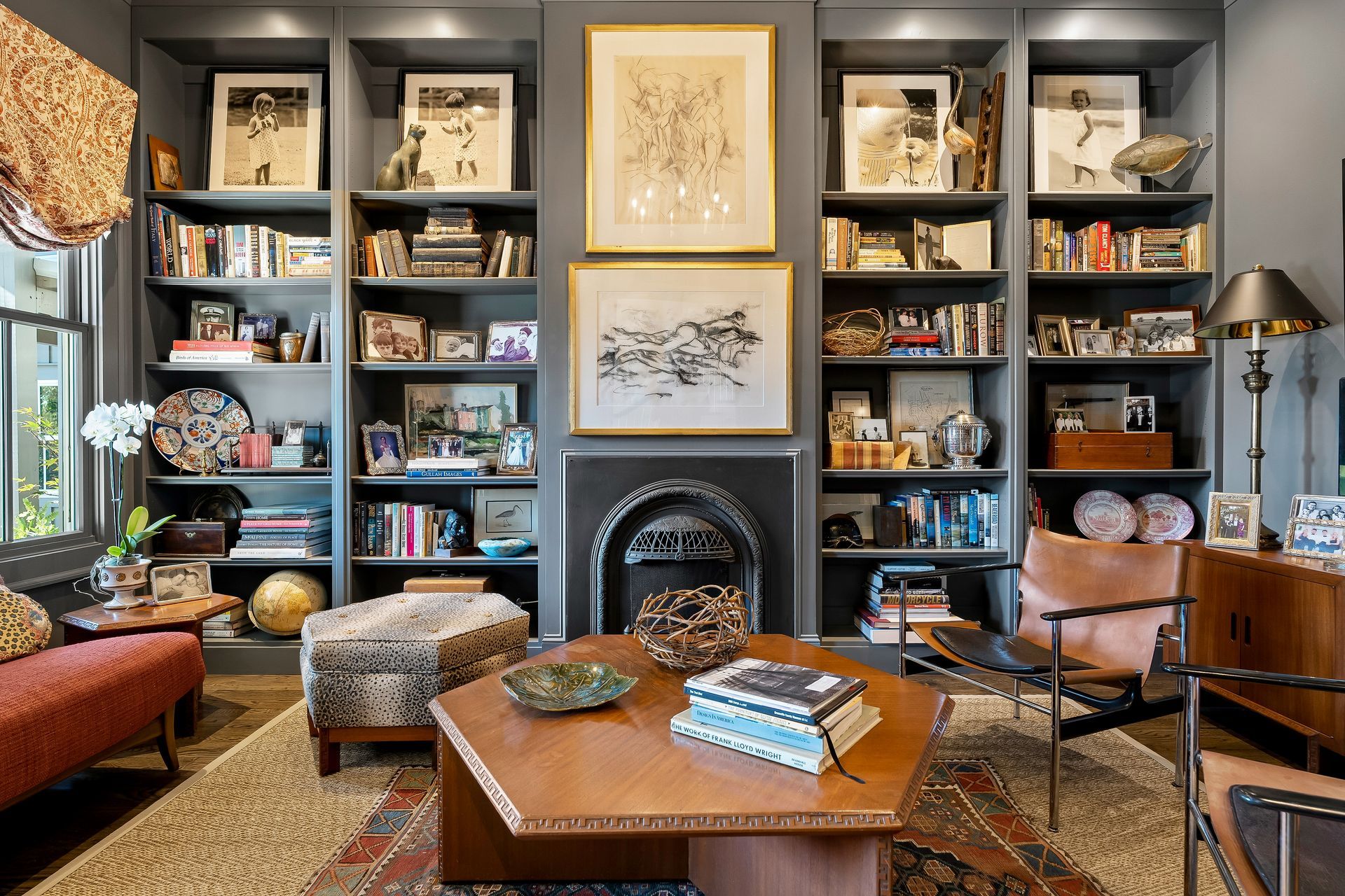 A living room filled with furniture and a fireplace.