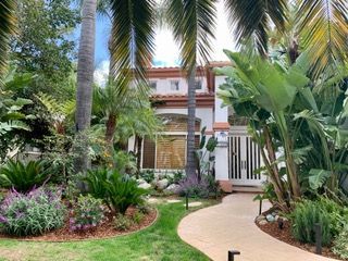 Pool area with illuminated landscaping.