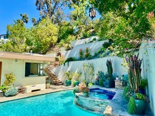 A modern building with lush landscaping.