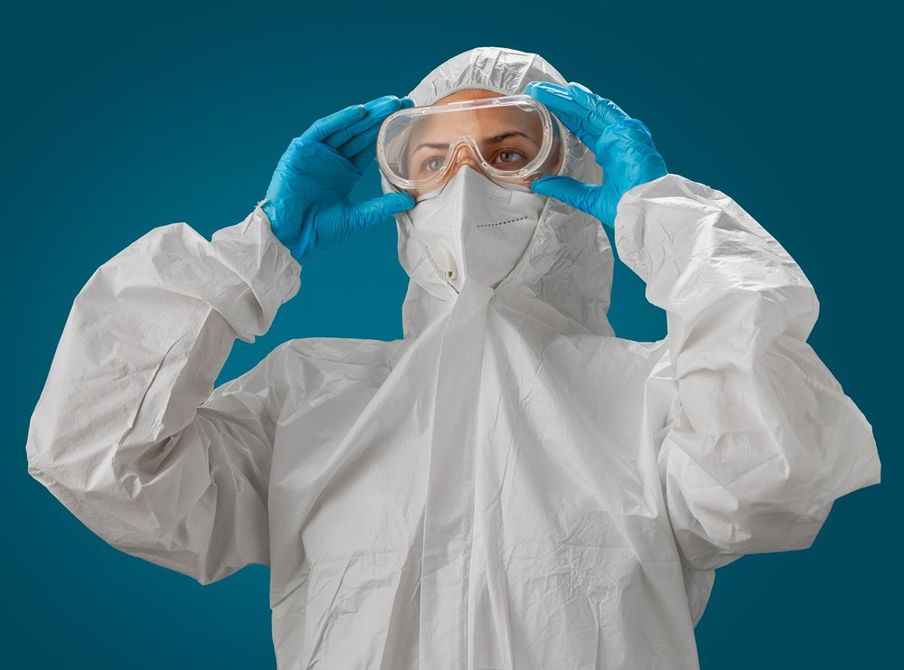 Medical Practitioner Wearing Lab Gown and Eye Gear