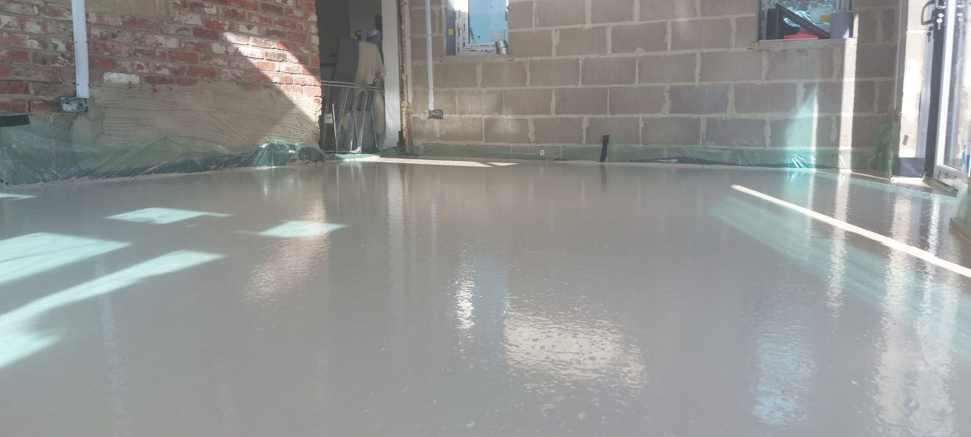 Liquid flow screed preparation, delivery and installation, removing liquid flow screed laitance, pump hire, by JC Flow Screeds in Essex.