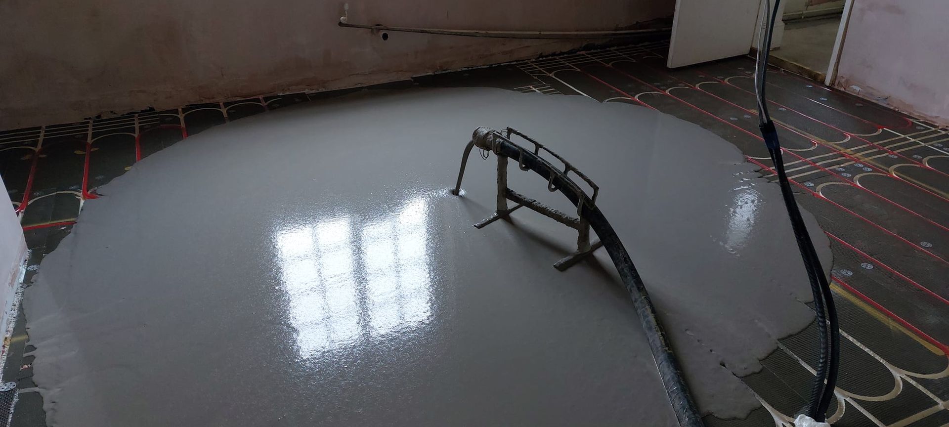 Liquid flow screed preparation, delivery and installation, removing liquid flow screed laitance, pump hire, by JC Flow Screeds in Essex.