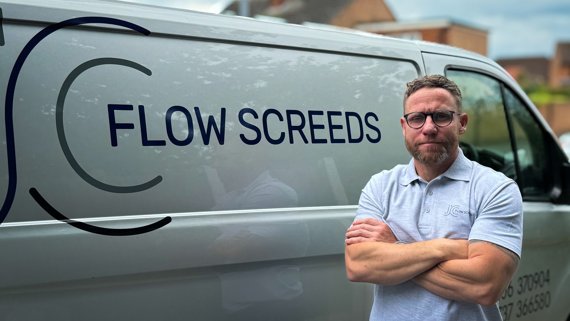 Colchester contractor Jim Chapman of JC Flow Screeds standing in front of van & liquid flow screed pump