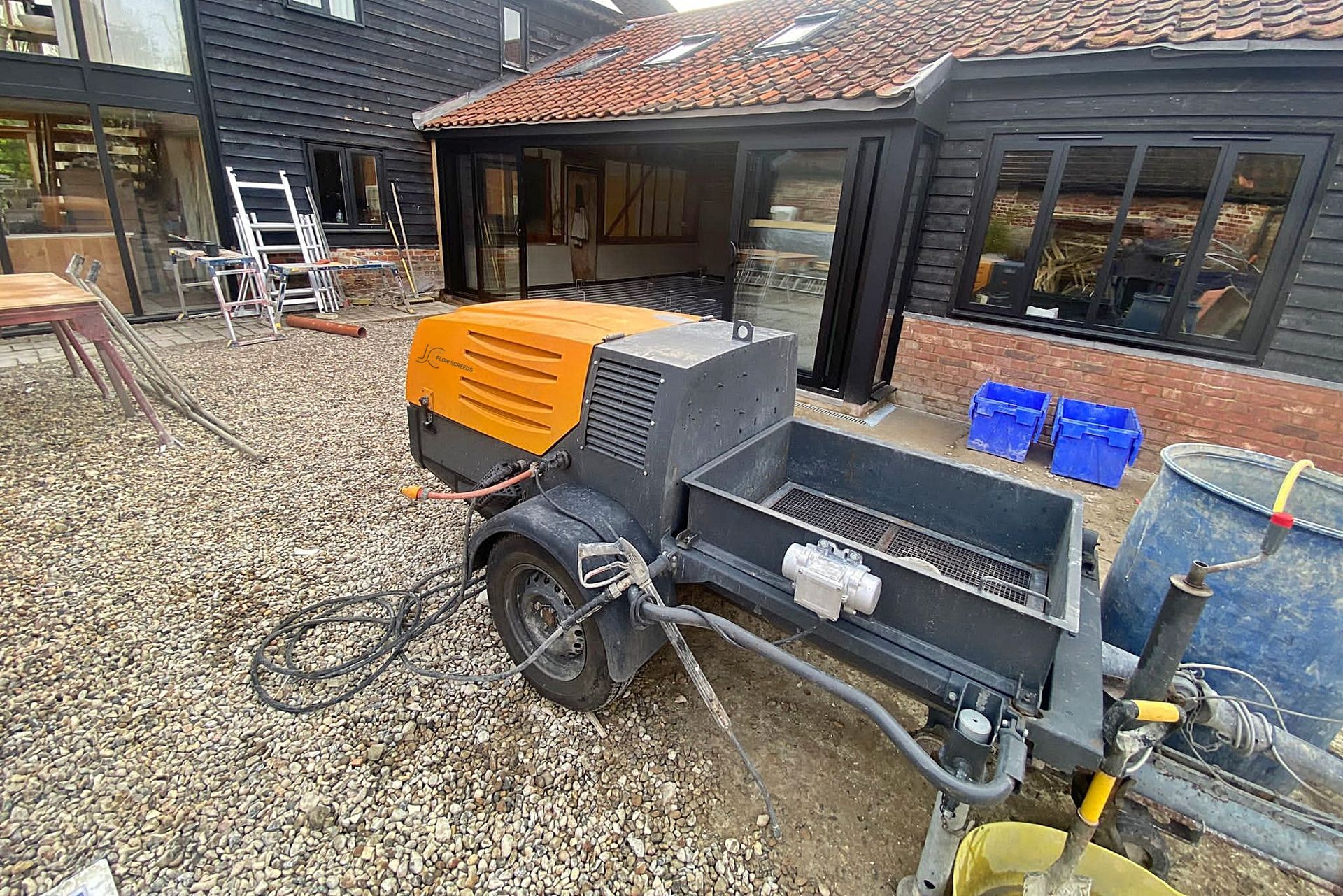 Liquid flow screed pump belonging to JC Flow Screeds in Colchester Essex.