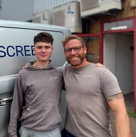 About JC Flow Screeds. Jim Chapman and Jimmy Chapman standing in front of works van and liquid flow screed pump.