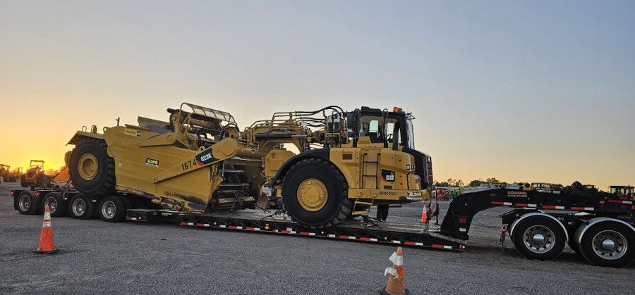 A truck towing an oversized load, displaying an 