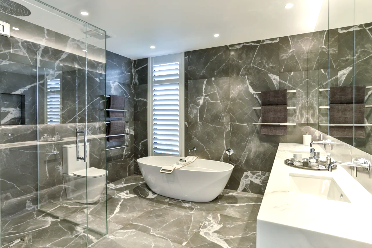 A bathroom with a bathtub, sink, toilet and walk in shower.