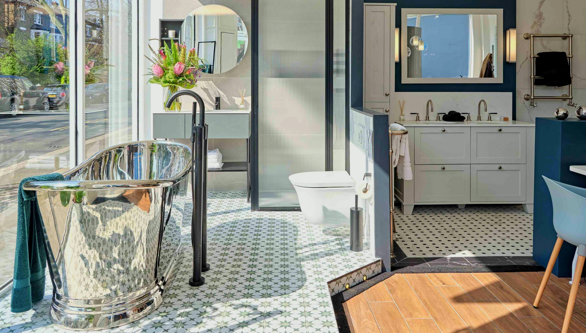 A bathroom with a bathtub, sink, toilet and mirror.