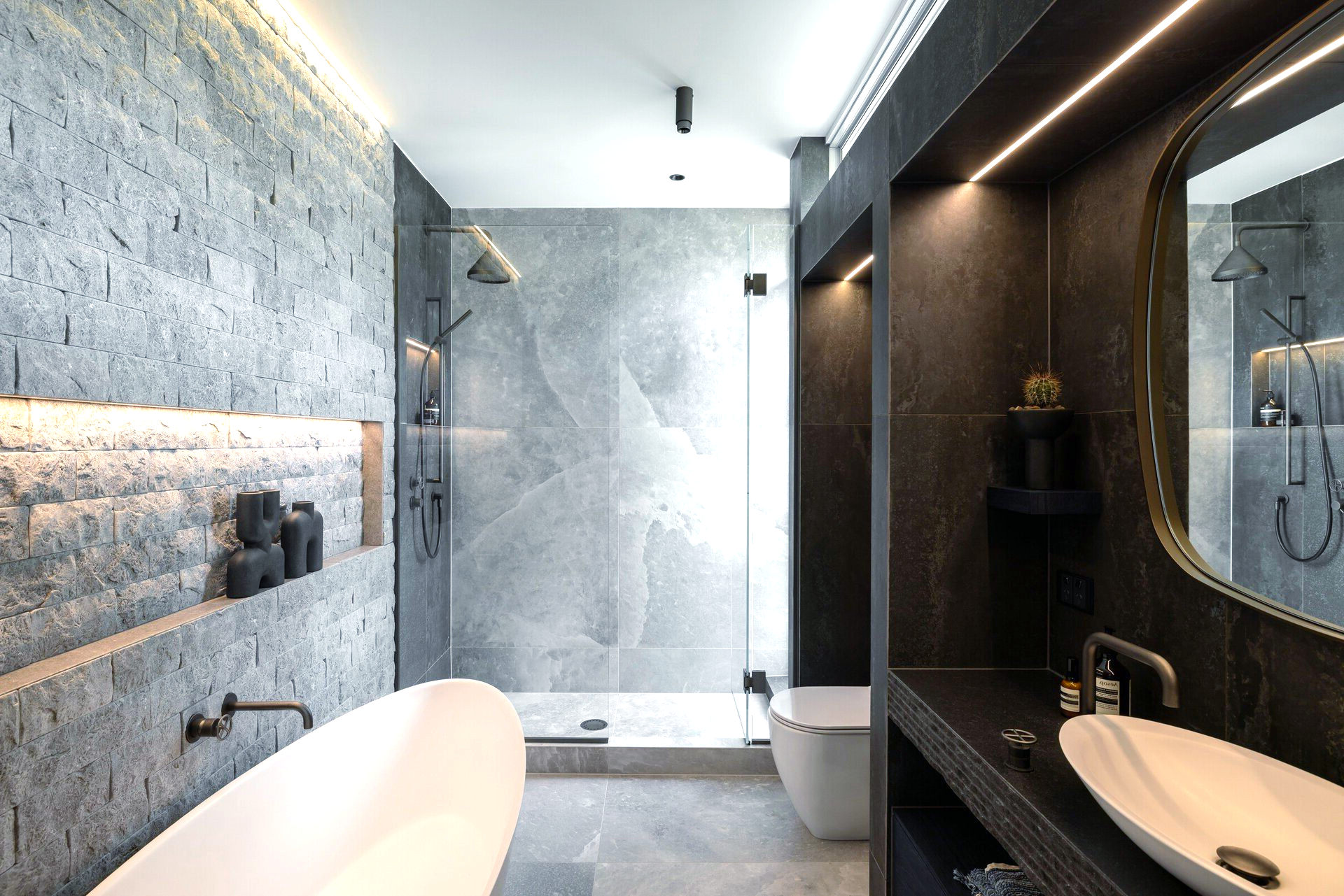 A bathroom with a bathtub, sink, toilet and shower.