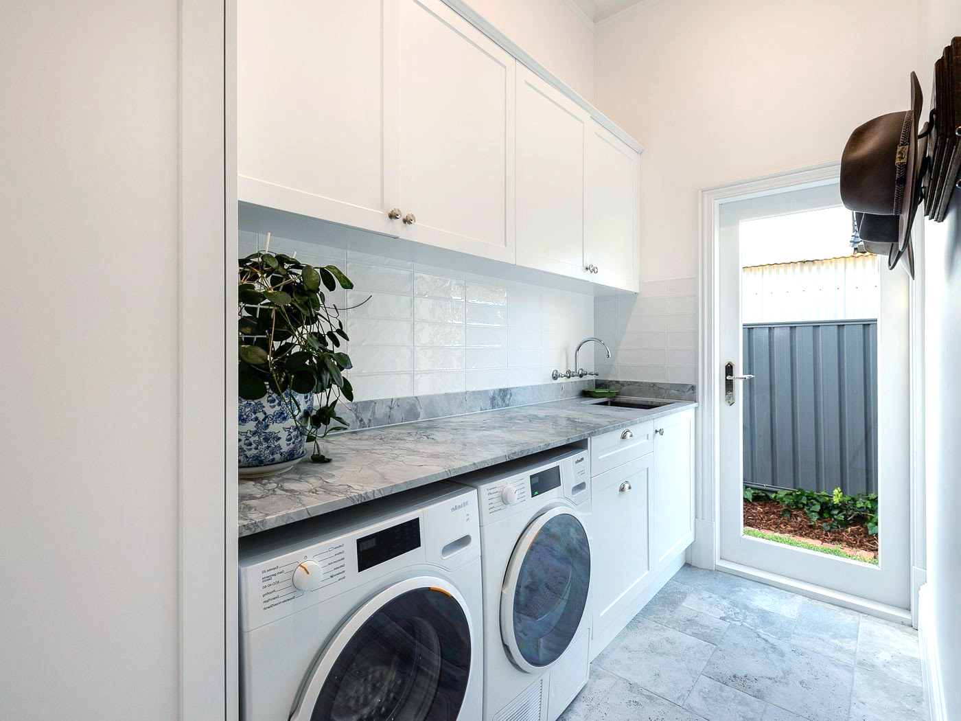 There is a washer and dryer in the laundry room.