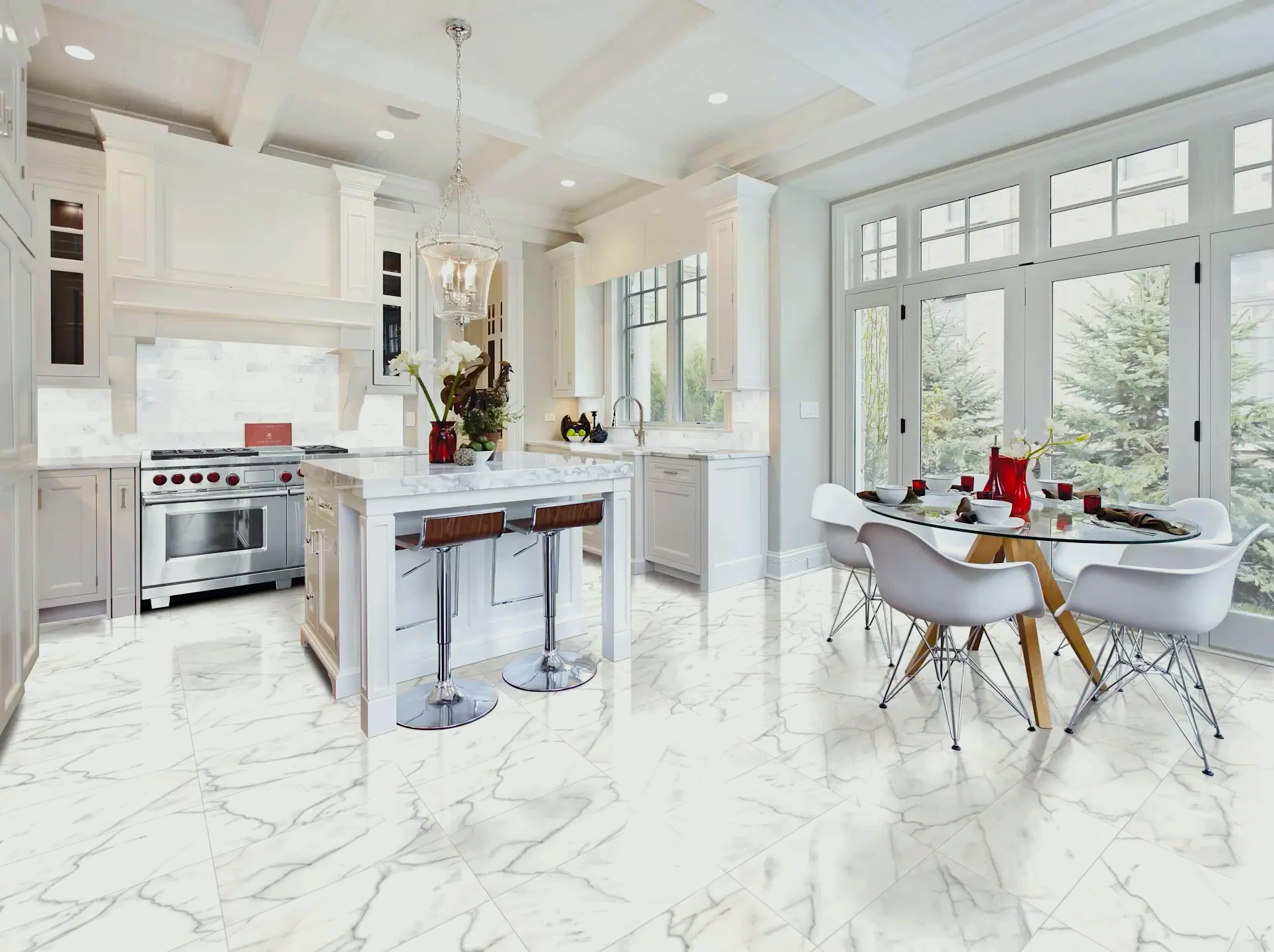 An open plan kitchen with white marble flooring.