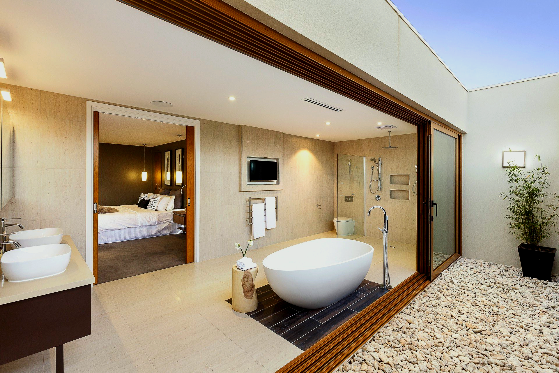 A bathroom with a bathtub and two sinks.