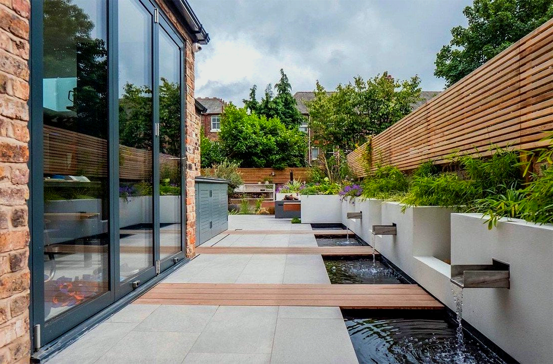 There is a pond in the middle of the garden.
